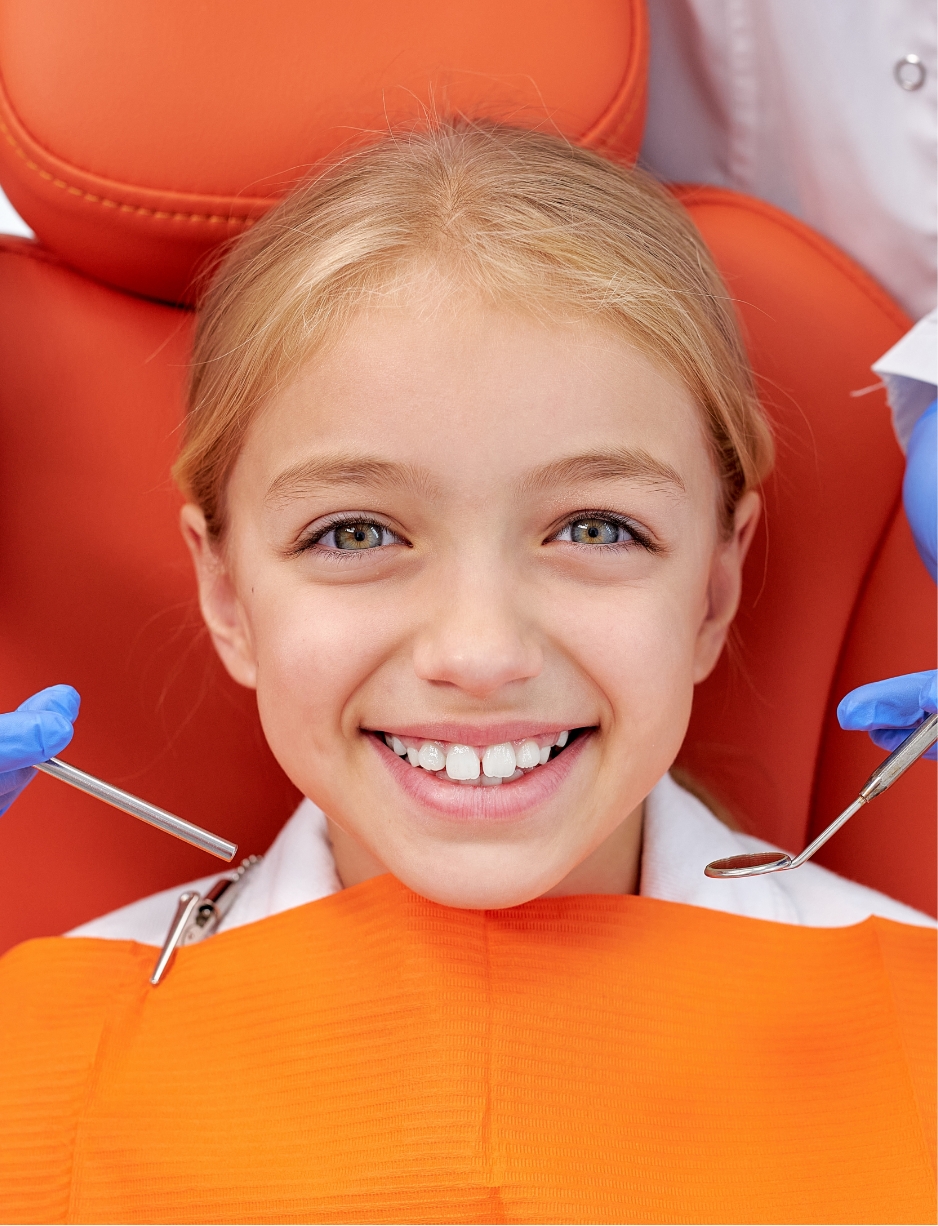image of a child smilling in the patient chair at the dental clinic alain cyr in boucherville