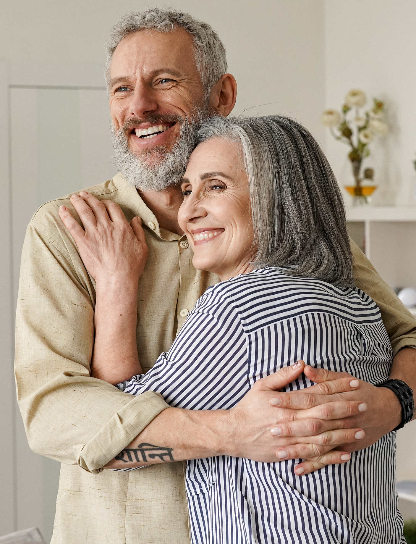 an image of a happy couple with beautiful smiles after their treatments at the Alain Cyr Dental Clinic