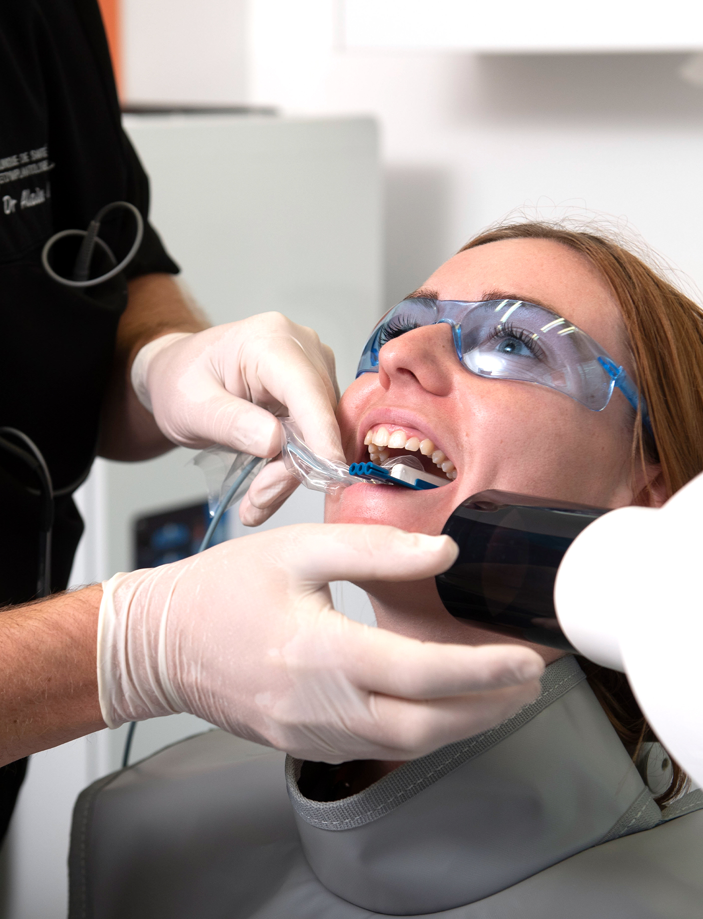 An image of a woman getting a dental X-ray