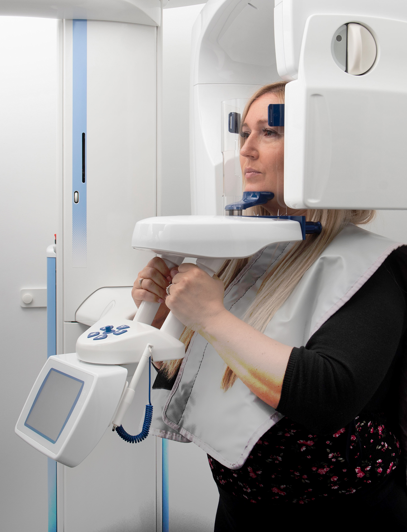an image of a woman getting a dental scan 3 d at the dental clinic