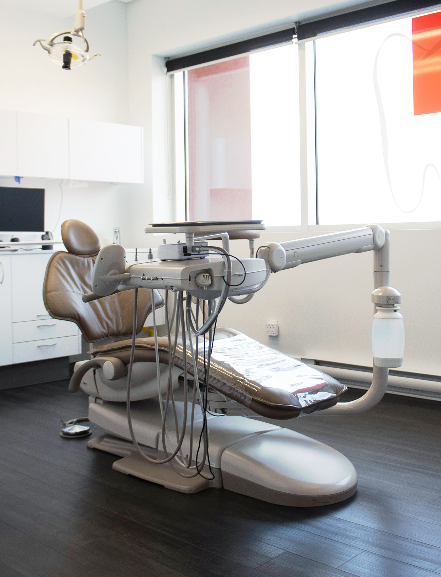 Modern room with a comfortable chair where the dentist will provide services to the patient